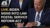President Biden signs into law the Postal Service 