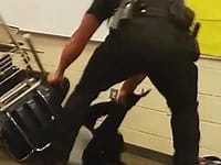 Police Officer Appears to Manhandle Student ......